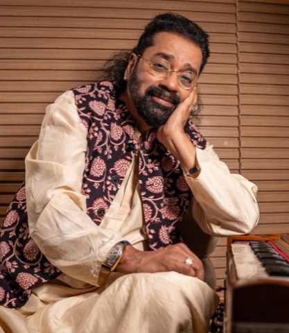 Hariharan in a navy bandhgala